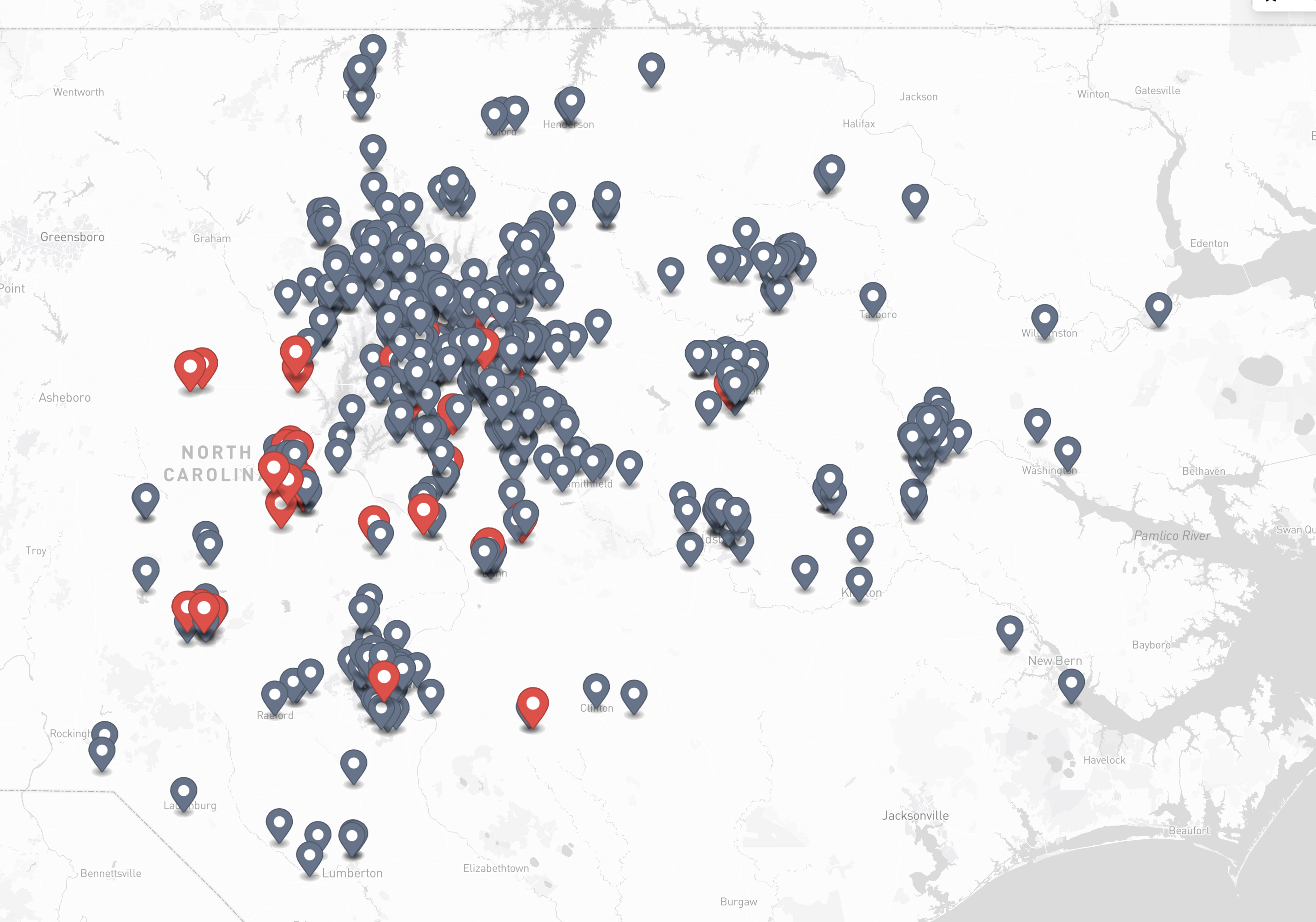 JanGuard regional map of central and eastern North Carolina with clustered facility pins and red service attention markers